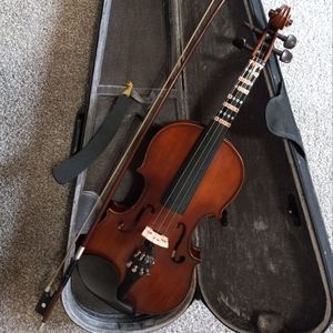 Training violin with case.